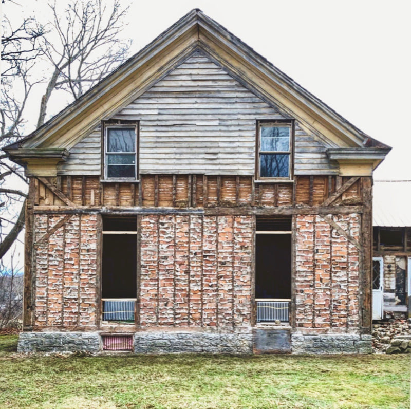 Fleur Flower Farmhouse mid renovation, exposed brick, bare bones